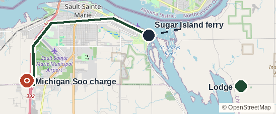Close-up of Sault Ste. Marie, Michigan. The red pin is the Supercharger, the only real charge. A short dash is the Sugar Island ferry. The green pin is the lodge on the island.